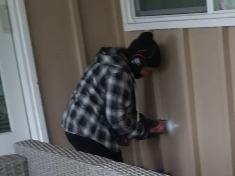 Professional electrician installing an exterior outlet in Brady